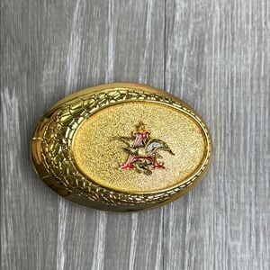 Gold Oval belt buckle with Red Accent